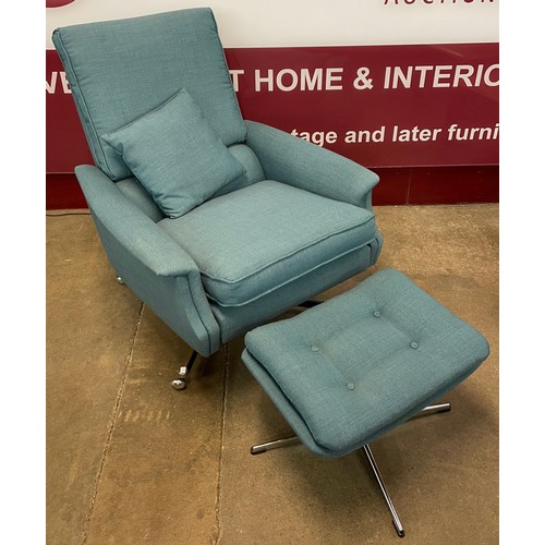 78B - A chrome and blue fabric upholstered revolving lounge chair and ottoman