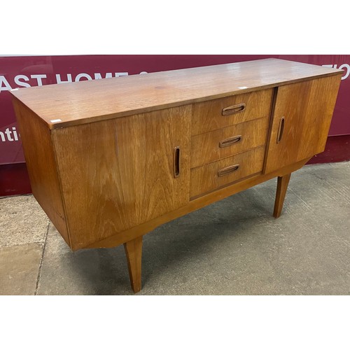 81 - A small teak sideboard