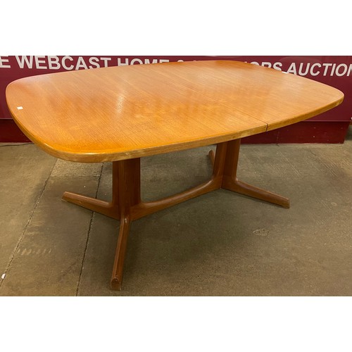 90 - A Danish teak extending dining table