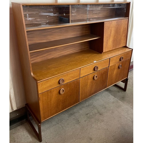 95 - A teak highboard