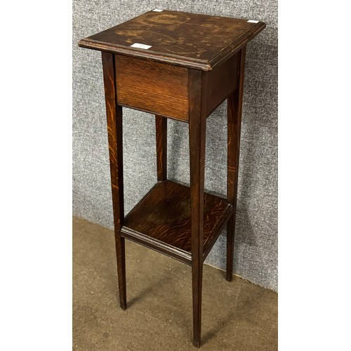 153 - An early 20th Century oak jardiniere stand