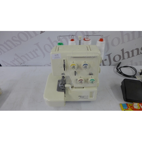 5176 - A My Lock 134 D differential feed sewing machine with pedal and a bag of assorted consumables