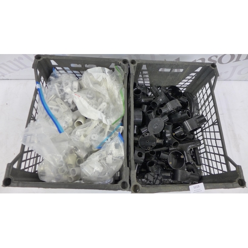 5219 - A box of white plastic conduit boxes, saddles, etc., and a box of black plastic conduit boxes and sa... 