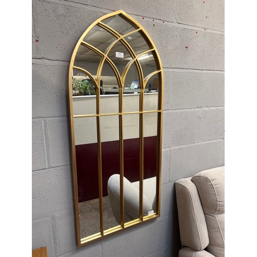 3053 - A gold metal framed church style mirror, 110cm