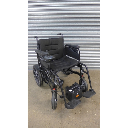 5069 - A Mobility Plus electric mobility wheelchair with battery charger and footrests