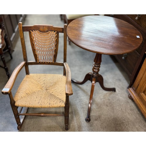 174 - An Arts & Crafts oak, bergere and rush seated child's rocking chair and a Victorian mahogany tilt to... 