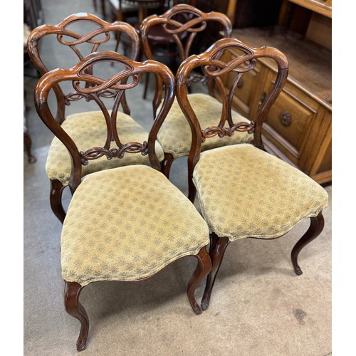 176 - A set of four early Victorian carved rosewood dining chairs