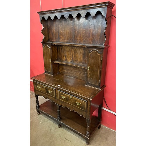 126 - A George III and later inlaid oak dresser