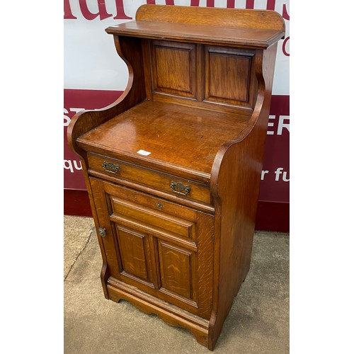 127 - A Victorian carved oak side cabinet