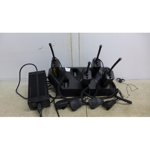 5065A - Four motorola Radius p110 2 channel radios with 6 bay charging dock station  * *Police repossession