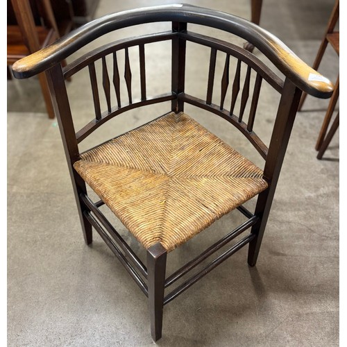 195 - A Edward VII beech and rush seated corner chair