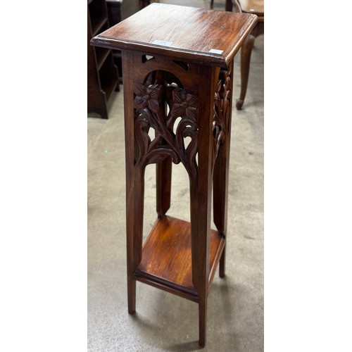 196 - An Art Nouveau style carved hardwood jardiniere stand