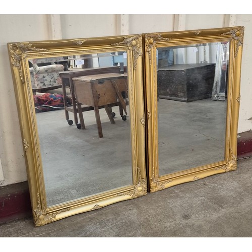 309 - A pair of French style gilt framed mirrors, 90 x 64cms