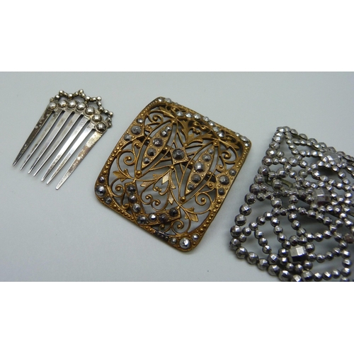 1002 - A pair of French cut steel buckles and one other, together with a comb marked 900