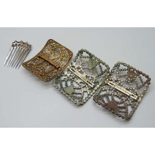 1002 - A pair of French cut steel buckles and one other, together with a comb marked 900