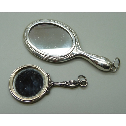 1003 - Two silver miniature hand mirrors, largest 7.5cm