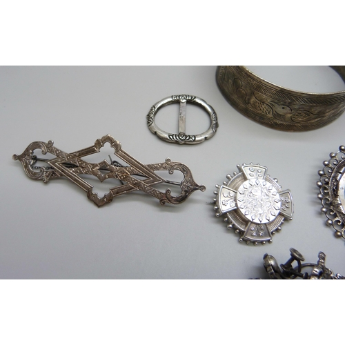 1017 - A collection of silver and white metal jewellery including a bangle marked 800, silver brooches, sil... 