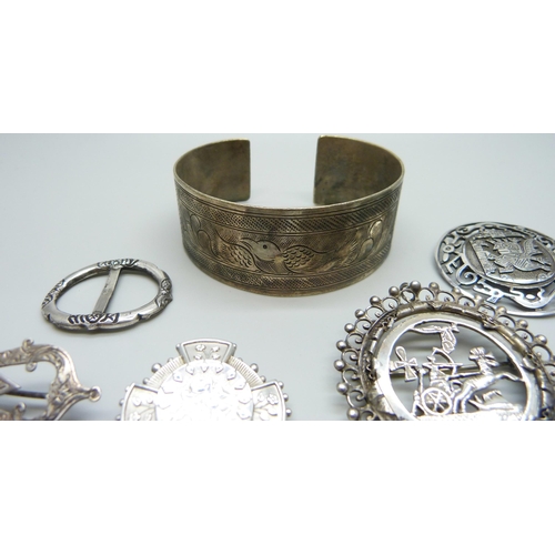 1017 - A collection of silver and white metal jewellery including a bangle marked 800, silver brooches, sil... 