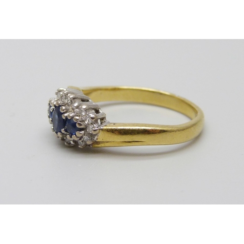 1021 - An 18ct gold sapphire and diamond cluster ring, 4g, L