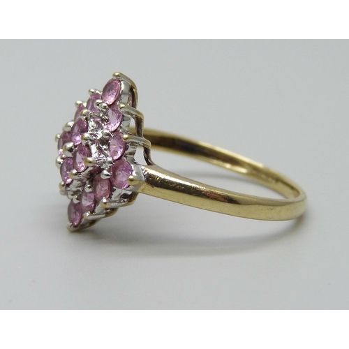 1026 - A 9ct gold pink sapphire cluster ring, 2.6g, R