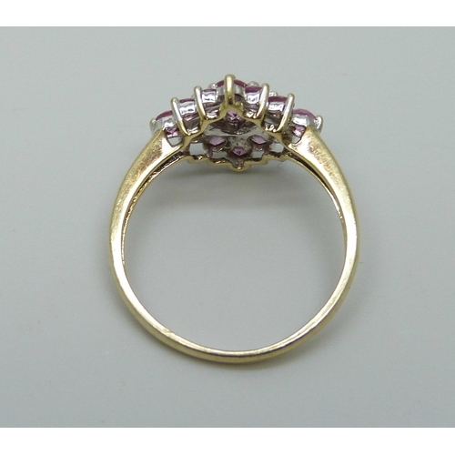 1026 - A 9ct gold pink sapphire cluster ring, 2.6g, R