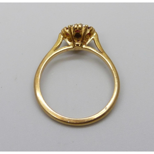 1029 - An 18ct gold, ruby and diamond ring, 3.1g, M