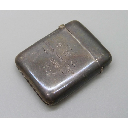 1035 - A late Victorian silver vesta case, Chester 1897, with later inscription dated 1900, 