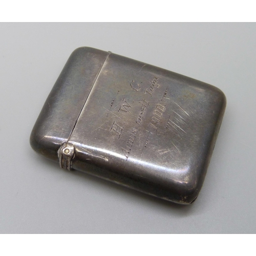 1035 - A late Victorian silver vesta case, Chester 1897, with later inscription dated 1900, 