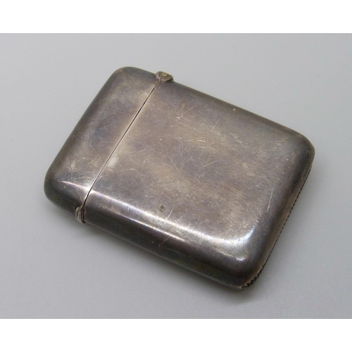 1035 - A late Victorian silver vesta case, Chester 1897, with later inscription dated 1900, 