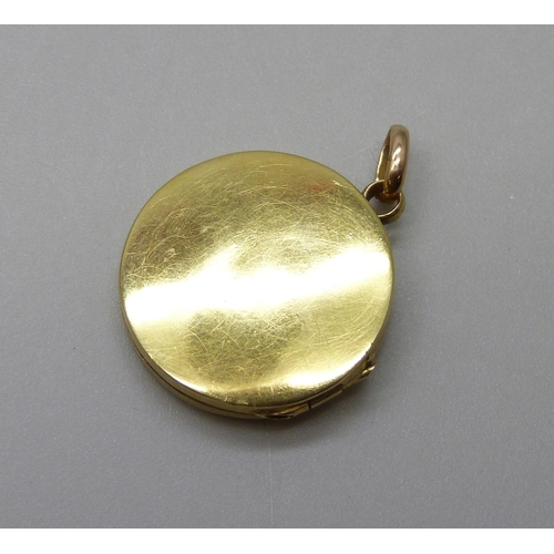 1036 - A 15ct gold Art Nouveau diamond set locket, 3.2g, 1.8cm