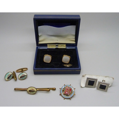 1037 - A pair of Queen Mary cruise liner cufflinks with matching tie-clip, an enamelled badge and two other... 