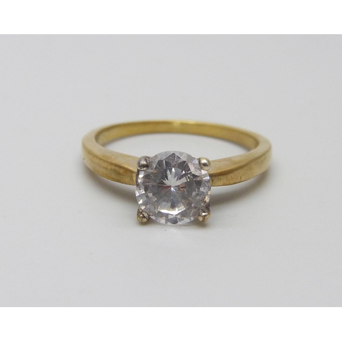 1043 - A silver gilt diamond simulant solitaire ring, O