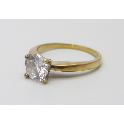 1043 - A silver gilt diamond simulant solitaire ring, O