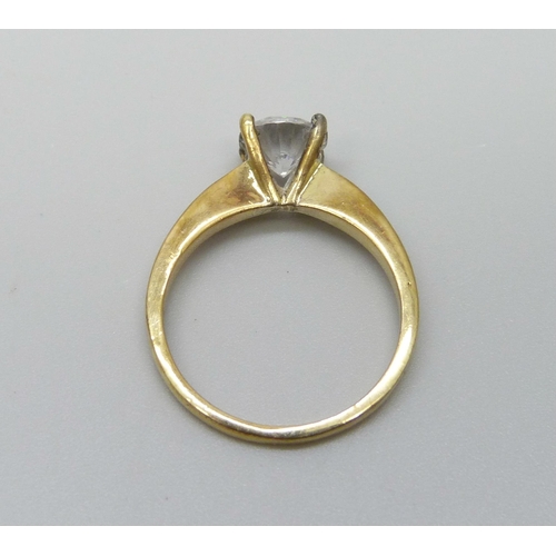 1043 - A silver gilt diamond simulant solitaire ring, O