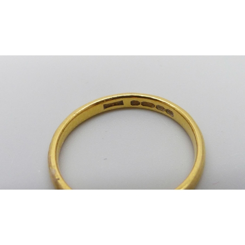 1048 - A 22ct gold ring, 2.8g, L, (band slightly misshapen)