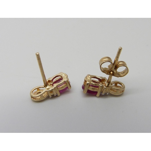 1050 - A pair of yellow metal, diamond and ruby earrings, marked DIA, one butterfly, 1.3g