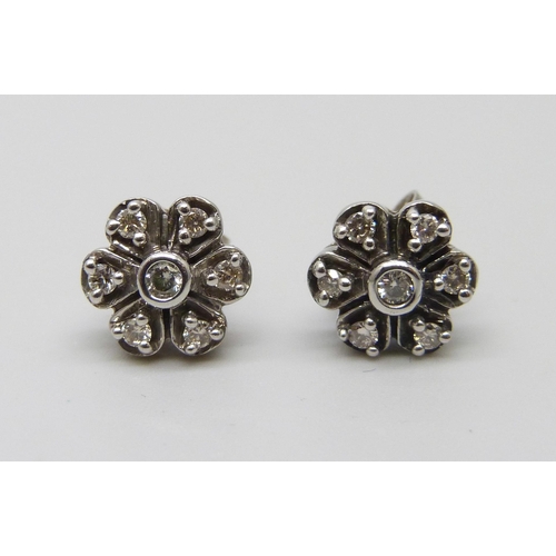 1053 - A pair of white metal flower design diamond set cluster earrings, the butterflies marked 375, 2.4g, ... 