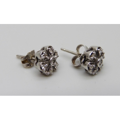 1053 - A pair of white metal flower design diamond set cluster earrings, the butterflies marked 375, 2.4g, ... 