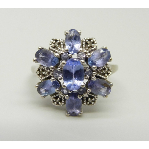 1056 - A 9ct white gold iolite cluster ring, 2.9g, O