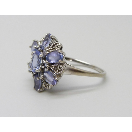 1056 - A 9ct white gold iolite cluster ring, 2.9g, O