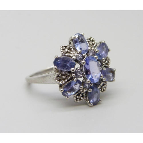 1056 - A 9ct white gold iolite cluster ring, 2.9g, O