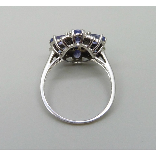 1056 - A 9ct white gold iolite cluster ring, 2.9g, O