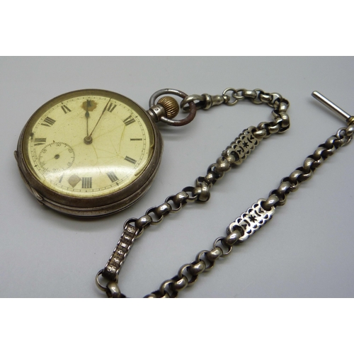 1061 - A silver pocket watch, London 1919, and a fancy link Albert chain