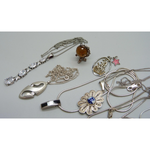 1081 - A collection of silver pendants and chains, 49g