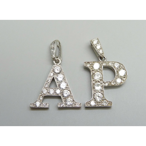 1086 - A pair of silver pendant letters 'A' and 'P', 11g