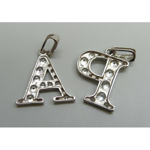 1086 - A pair of silver pendant letters 'A' and 'P', 11g