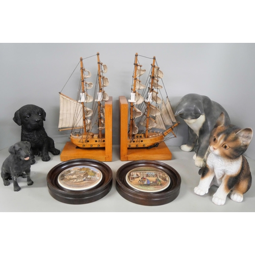 1120 - Two framed pot lids, two lustre jugs, a pair of Mayflower bookends, dog figures, pair of bird plaque... 