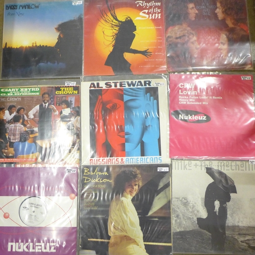 1165 - A collection of mixed genre LP records including Barry Manilow and Now That's What I Call Music 8 **... 