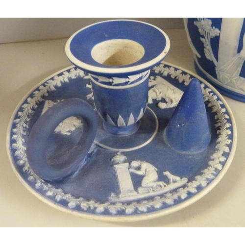 603 - Three items of Wedgwood dark blue jasper; twin handled vase, pot pourri and chamberstick