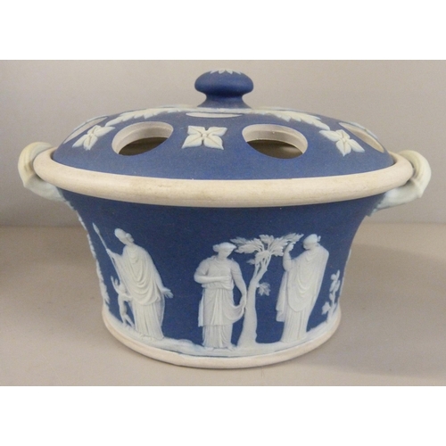 603 - Three items of Wedgwood dark blue jasper; twin handled vase, pot pourri and chamberstick